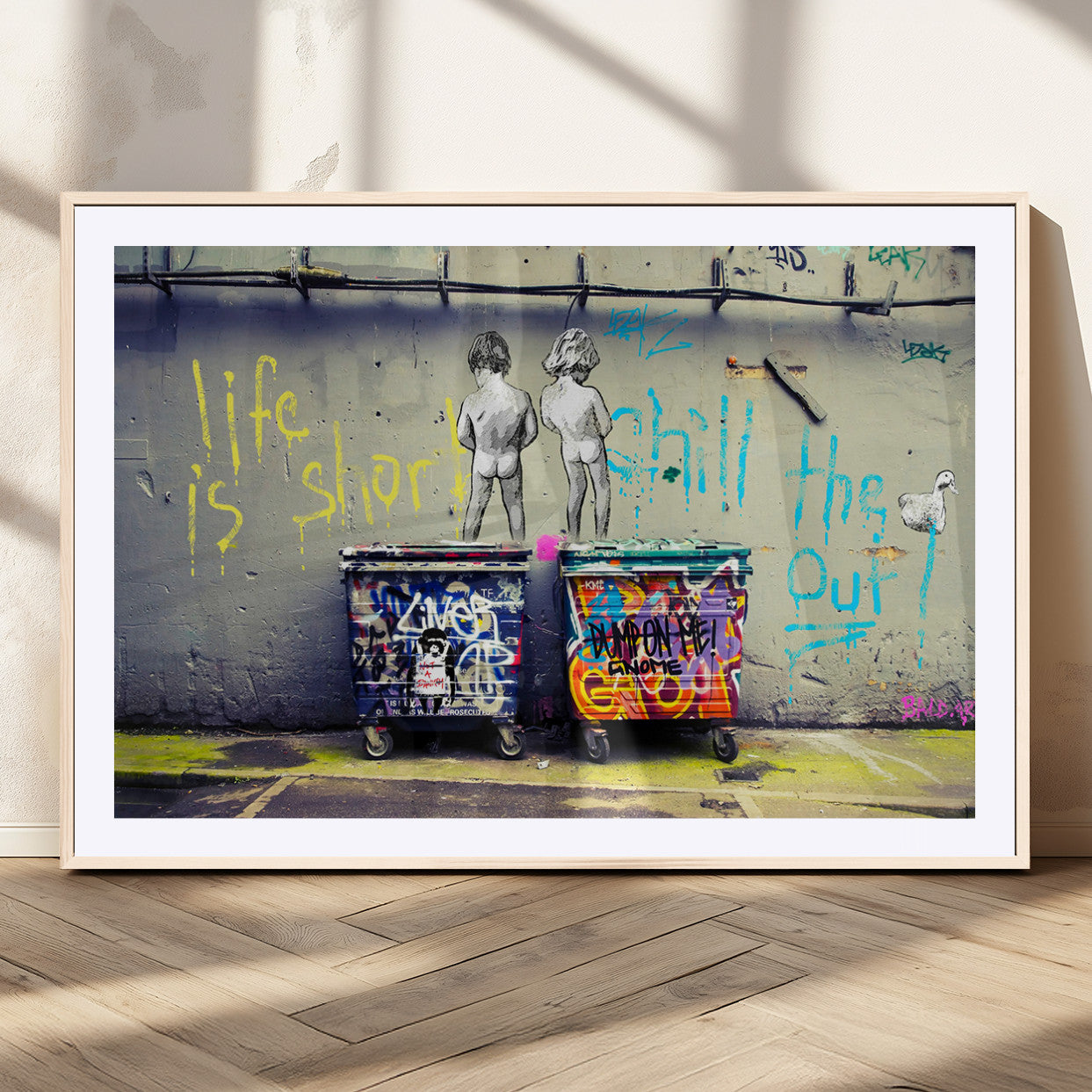 Graffiti-style canvas art with bold text and two naked figures over urban dumpsters, ideal for edgy or street-style decor.