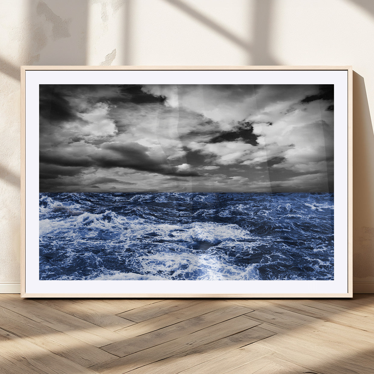 Moody canvas wall art of a stormy ocean under a dramatic black-and-white sky, perfect for bold or coastal-style interiors.