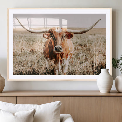 Framed longhorn cow canvas wall art with rustic prairie background, western animal print perfect for farmhouse or ranch style decor