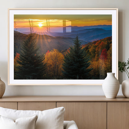 Vibrant sunset over autumn mountains with colorful trees and warm light, ideal for nature lovers or cabin-style wall decor.