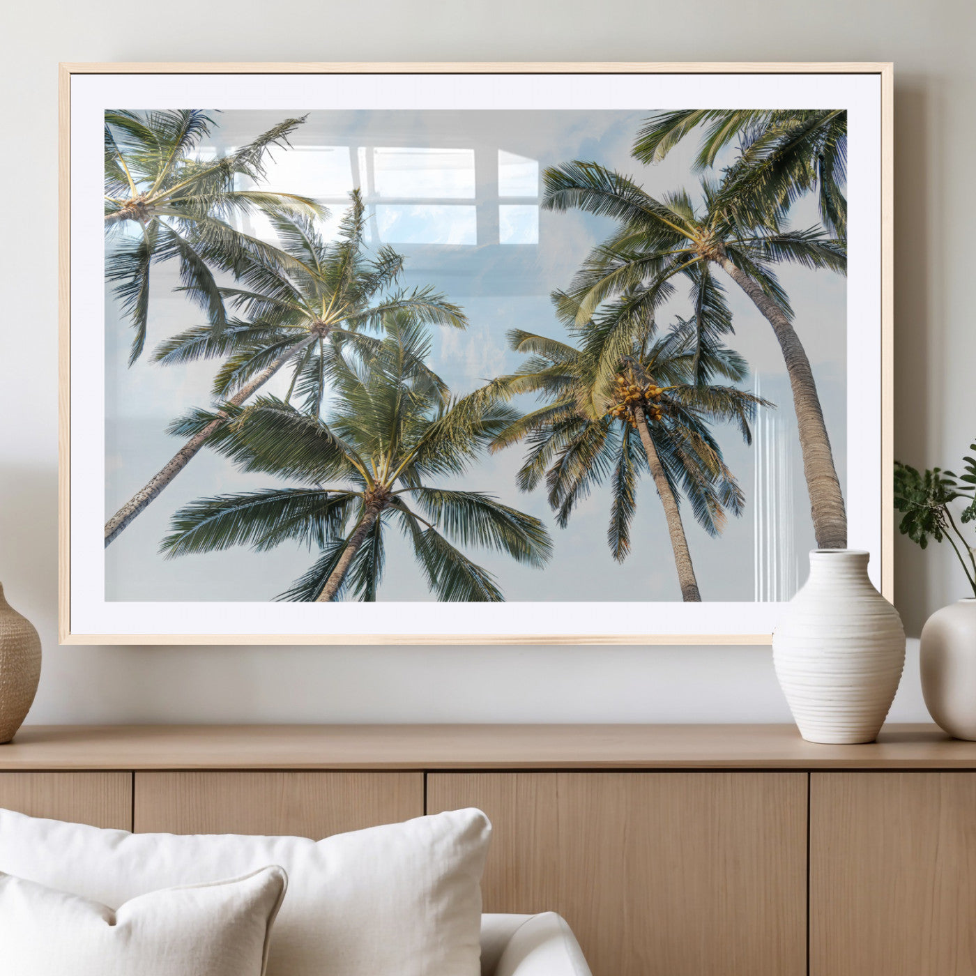Framed canvas of tall palm trees reaching into a tropical sky, ideal for beach home or relaxed island-inspired wall decor.