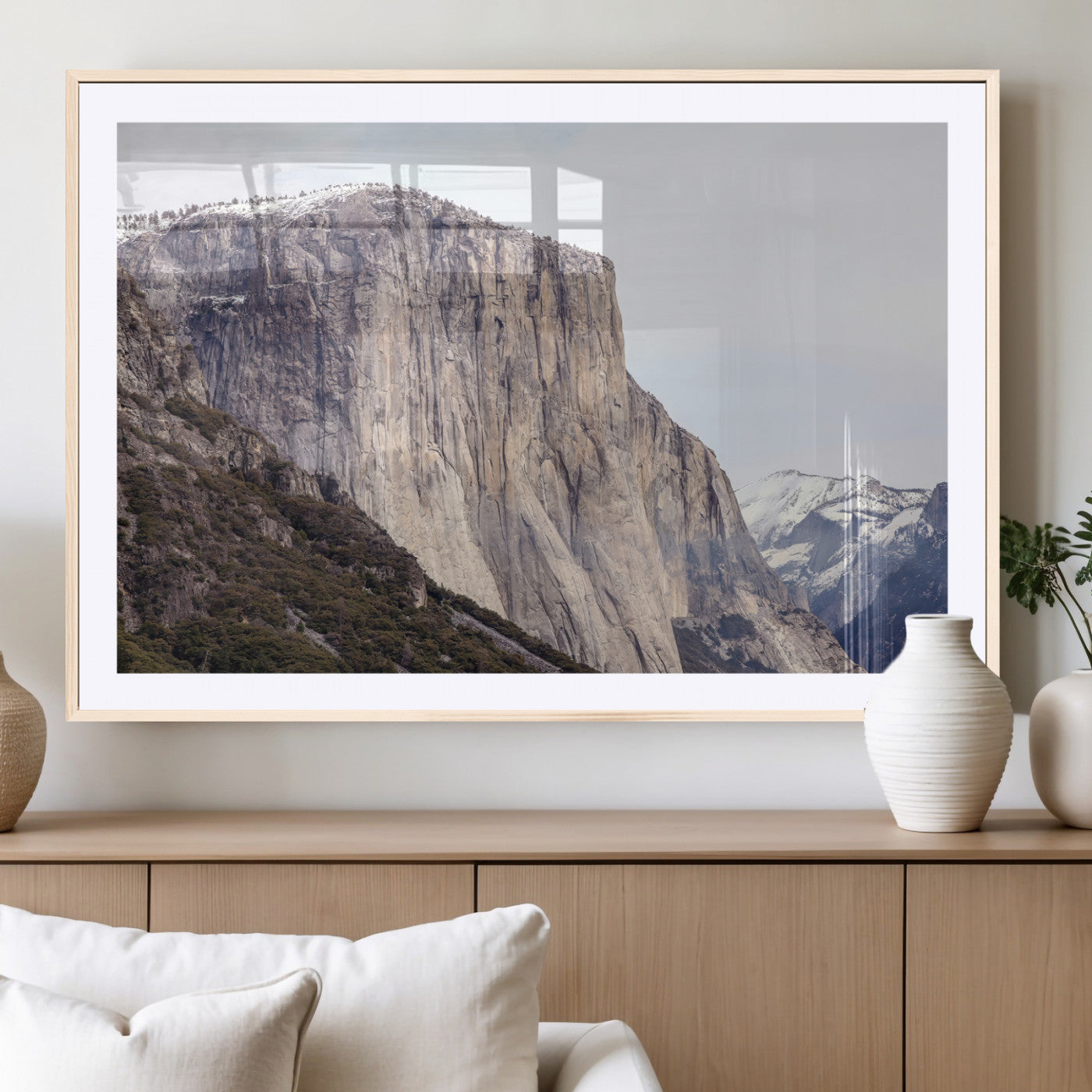 Framed canvas of El Capitan’s vertical granite face in Yosemite with snowy peaks, ideal for Sierra minimalism or mountain-inspired decor.