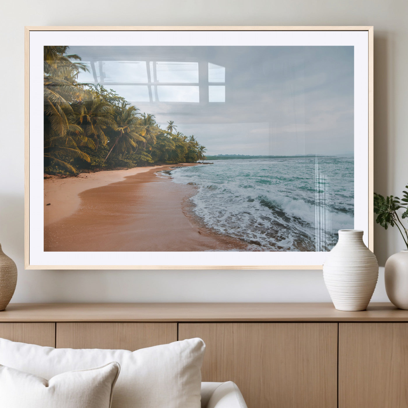 Framed canvas of a tropical beach with palm trees and soft waves, ideal for coastal escape or serene nature-inspired home decor.