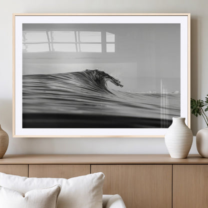 Striking black and white photo of a curling wave, ideal for modern coastal or minimalist wall decor settings.