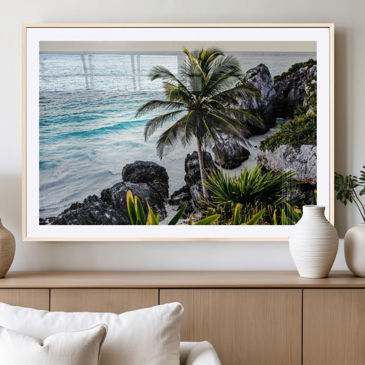 Framed canvas of a vibrant tropical coastline with palm trees, rocky cliffs, and turquoise waters, ideal for tropical coastal home decor.