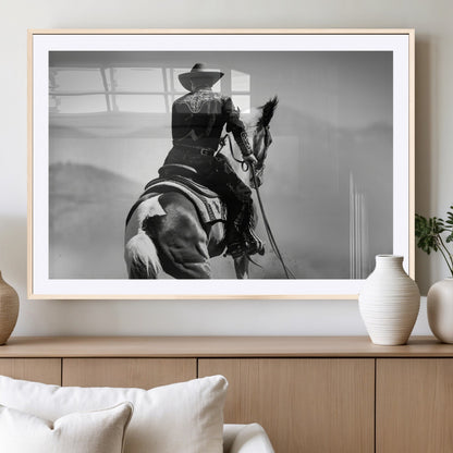 Black and white canvas of a cowboy on horseback with moody tones, perfect for rustic western or country-inspired home decor.