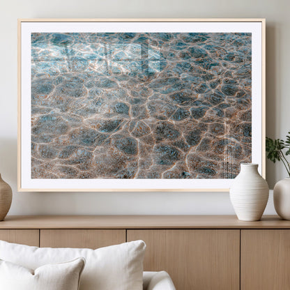 Close-up of sunlit ocean ripples with aqua blue and golden tones, ideal for modern coastal or minimalist home decor.