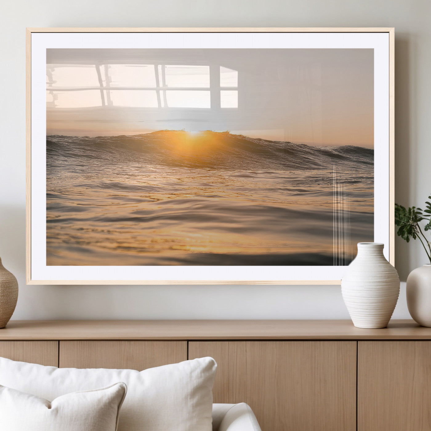 Ocean waves glowing under a warm golden sunset, reflecting soft light and calm movement, perfect for warm minimalist coastal interiors.