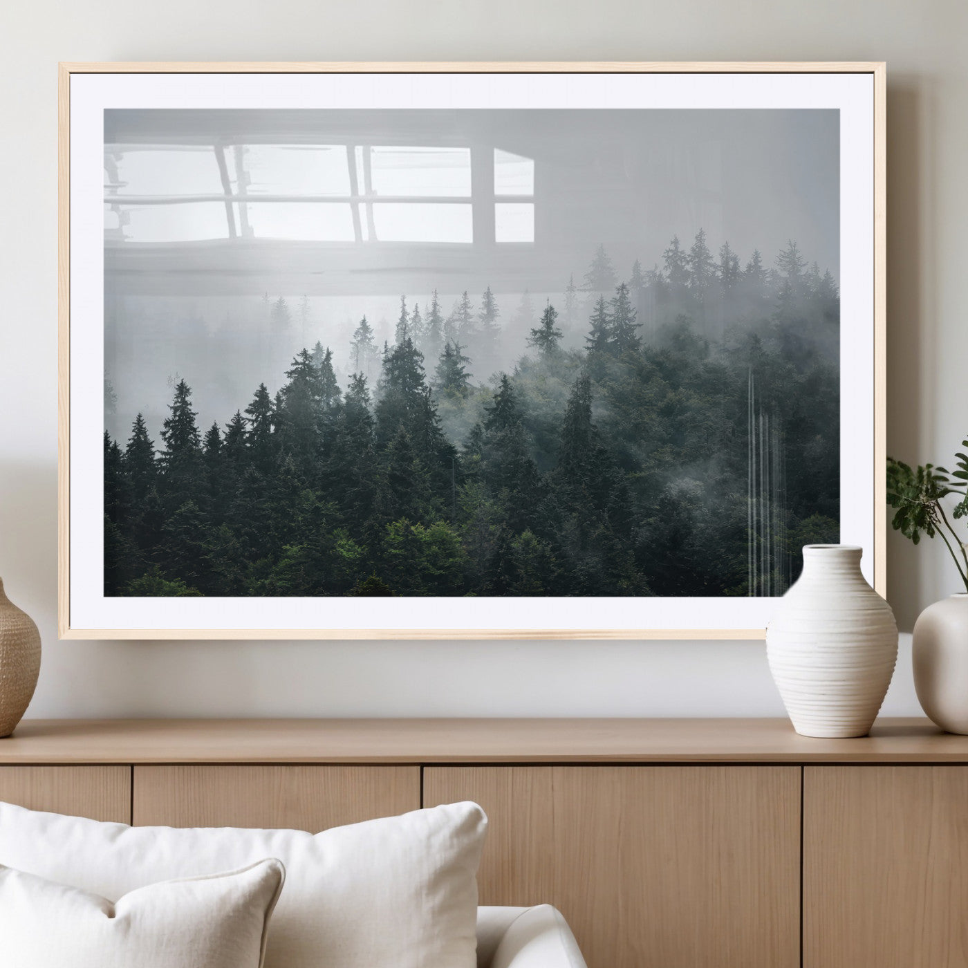 A misty evergreen forest shrouded in soft fog, creating a tranquil and moody landscape with lush green trees fading into the distance.