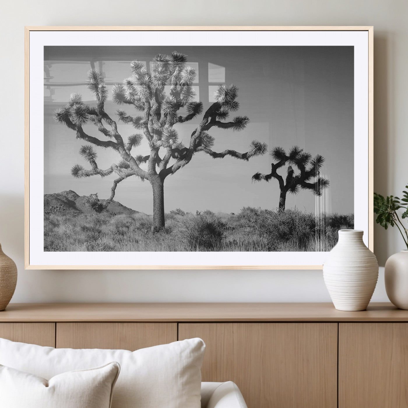 Black and white Joshua trees in a rugged desert landscape, creating a calm and minimalist feel for natural or rustic-themed interiors.