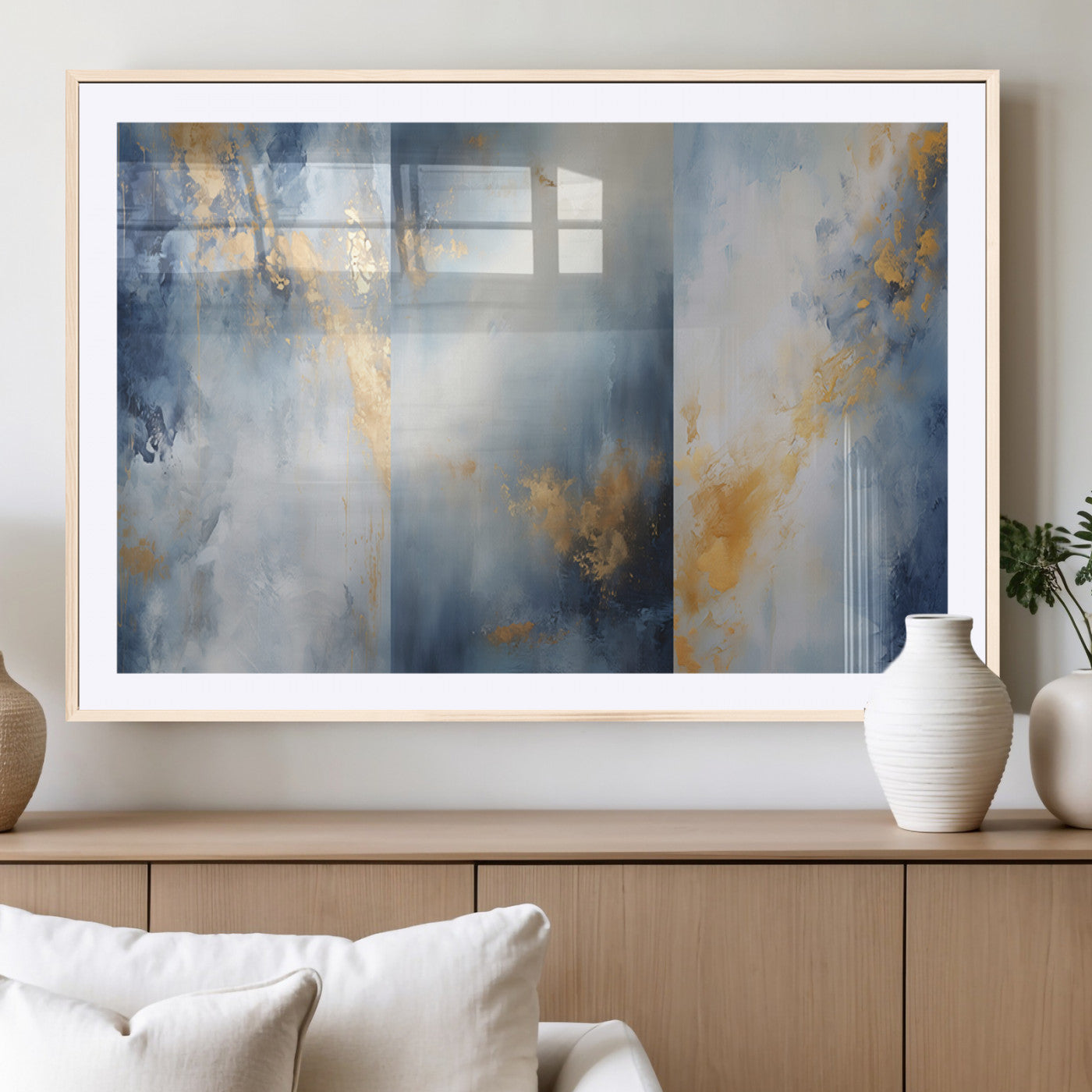 Abstract canvas art in soft blue and gold tones with textured brushstrokes, ideal for elegant or modern neutral decor spaces.
