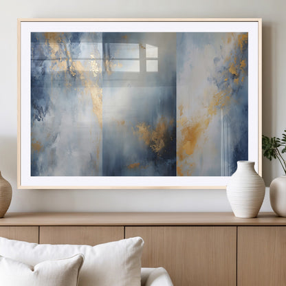 Abstract canvas art in soft blue and gold tones with textured brushstrokes, ideal for elegant or modern neutral decor spaces.