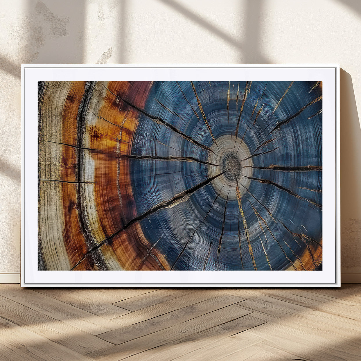 A stunning close-up view of a tree trunk, showcasing the intricate growth rings in a vibrant mix of warm browns, cool blues, and hints of natural texture.