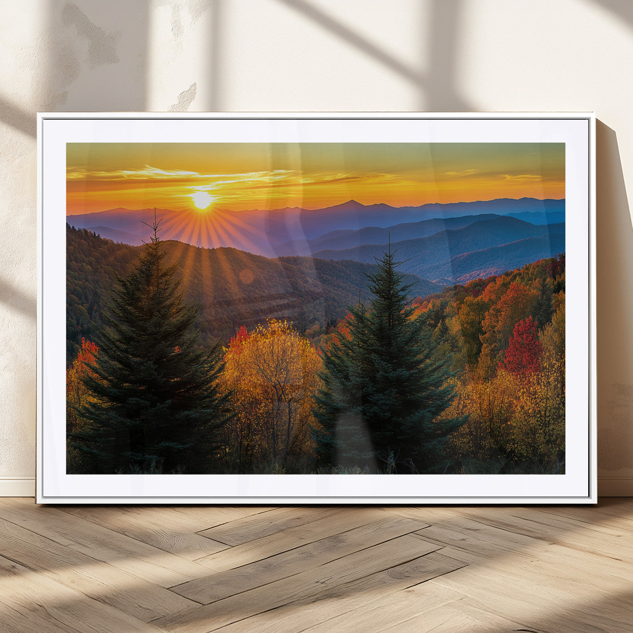 Vibrant sunset over autumn mountains with colorful trees and warm light, ideal for nature lovers or cabin-style wall decor.