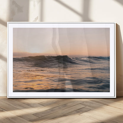 Framed canvas of ocean waves glowing in sunset light, ideal for golden hour calm or peaceful coastal-inspired wall decor.