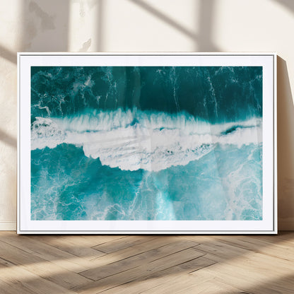 Aerial view of turquoise ocean waves crashing with white foam, perfect for tropical coastal or modern beach-style home decor.