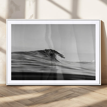 Striking black and white photo of a curling wave, ideal for modern coastal or minimalist wall decor settings.