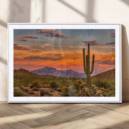 Vibrant desert sunset with saguaro cacti and distant mountains, perfect for Southwestern or warm-toned home decor.