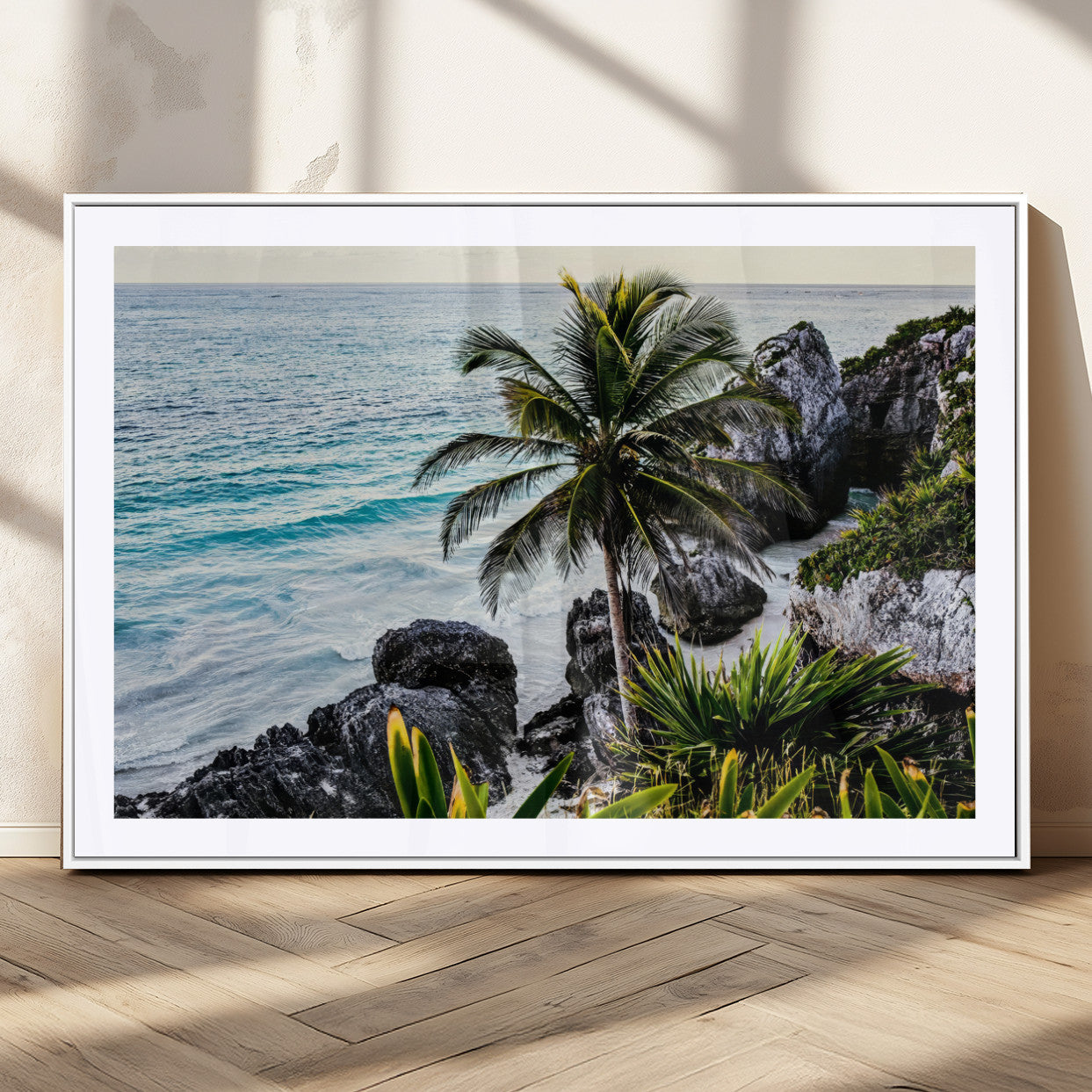 Framed canvas of a vibrant tropical coastline with palm trees, rocky cliffs, and turquoise waters, ideal for tropical coastal home decor.