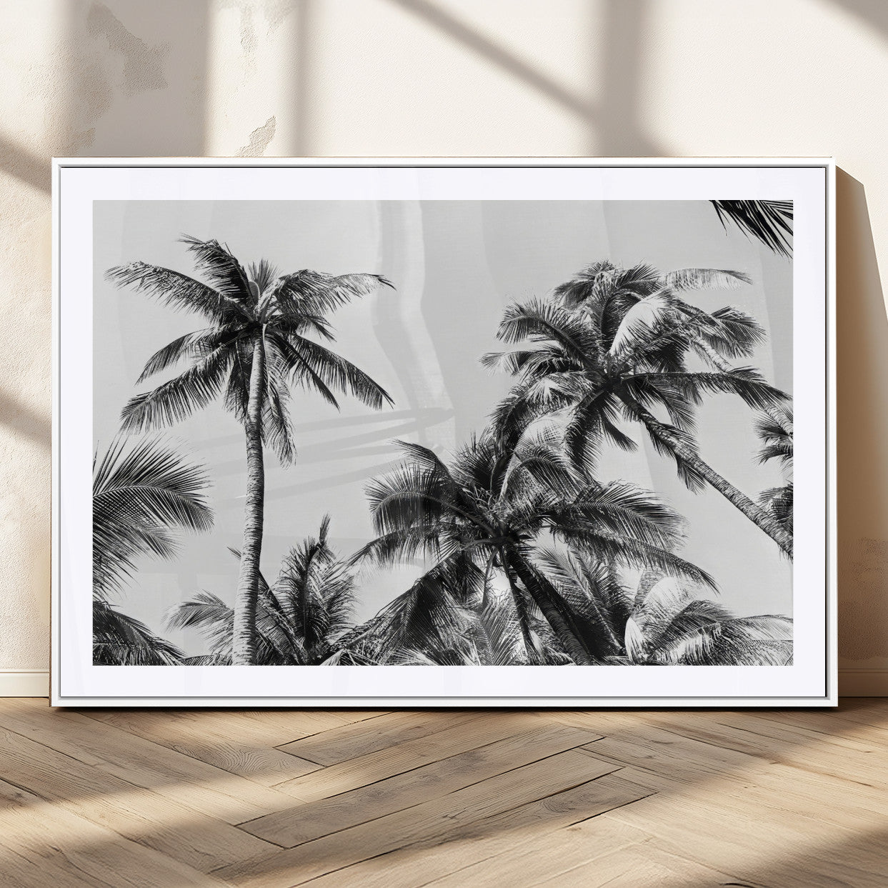 Black and white canvas of tall palm trees in moody tones, perfect for modern tropical minimalist or coastal-style home decor.