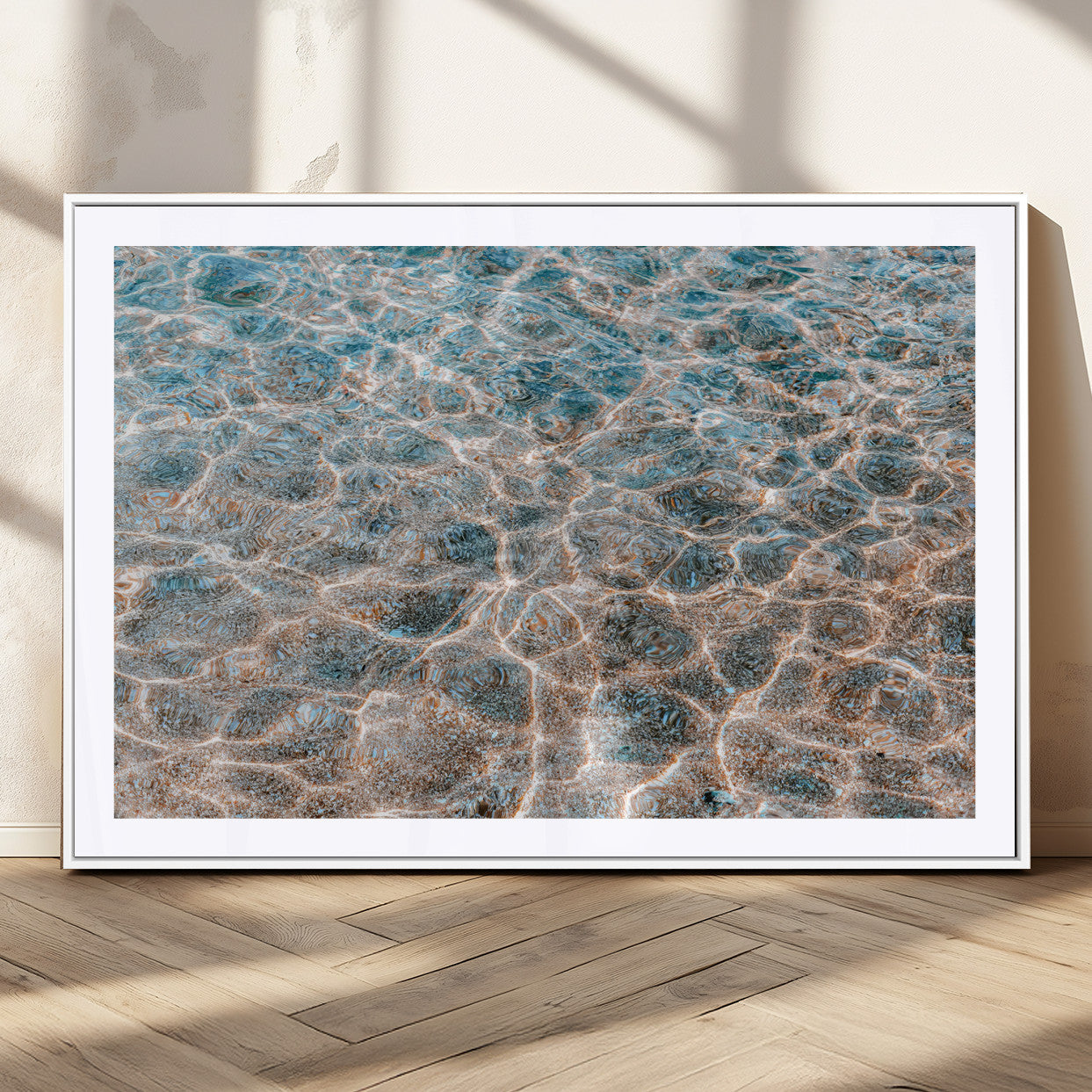 Close-up of sunlit ocean ripples with aqua blue and golden tones, ideal for modern coastal or minimalist home decor.