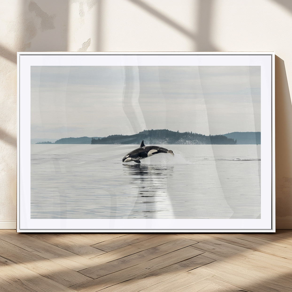 An orca jumping out of calm ocean waters with a misty island in the background, creating a serene and minimalist marine wildlife scene.