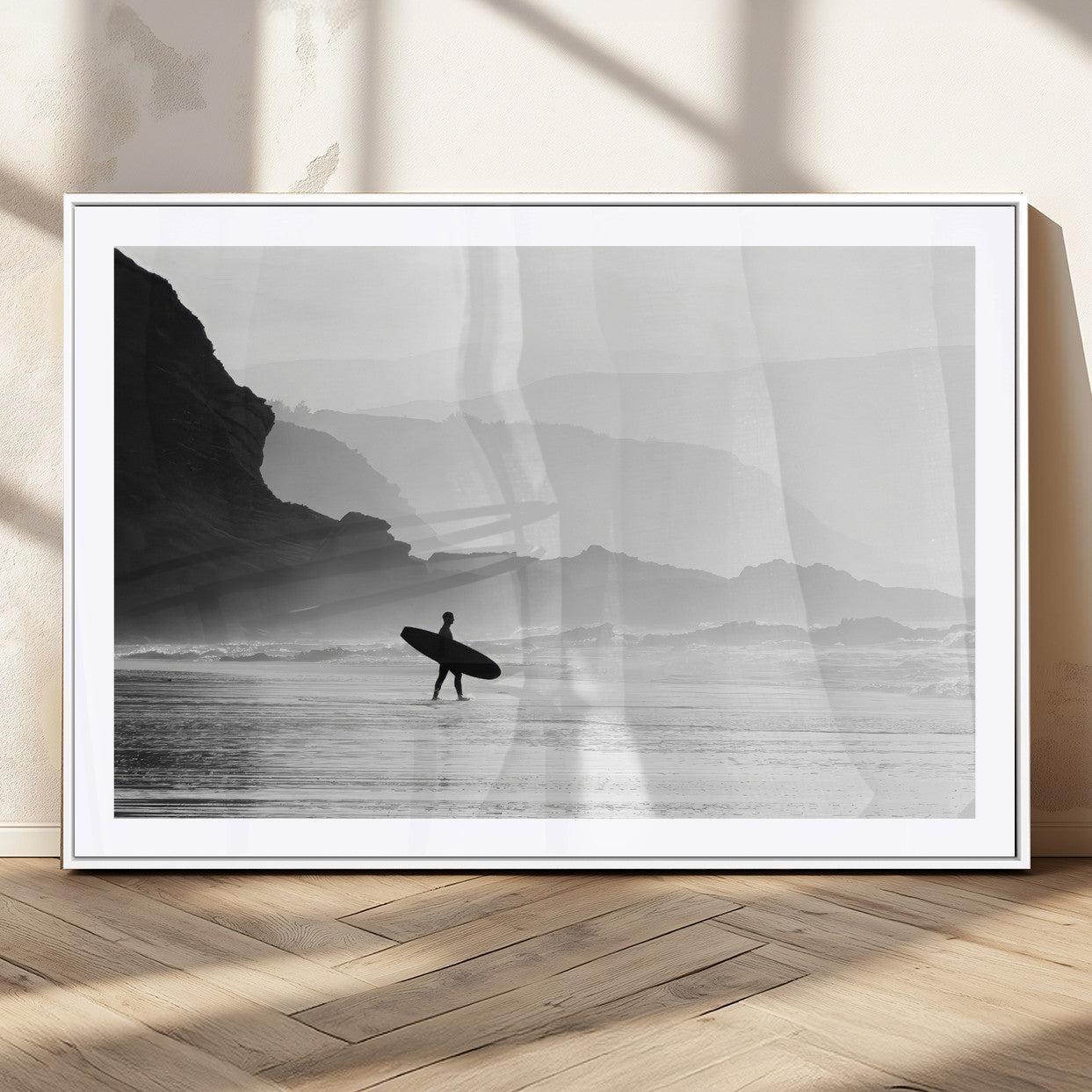A lone surfer walking along a misty beach with cliffs in the background, carrying their board, capturing a serene and minimal ocean moment.