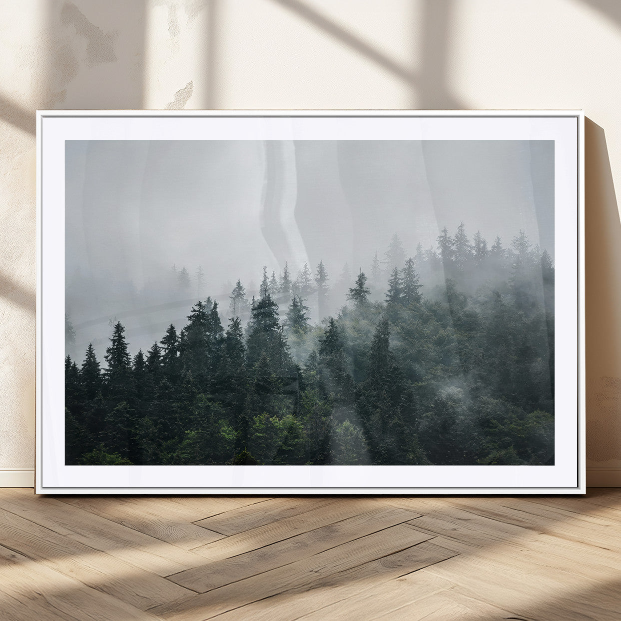 A misty evergreen forest shrouded in soft fog, creating a tranquil and moody landscape with lush green trees fading into the distance.