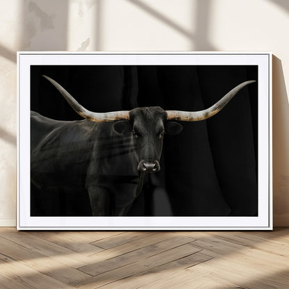 Close-up of a black Texas longhorn with large curved horns on black background, ideal for rustic farmhouse or modern western interiors.
