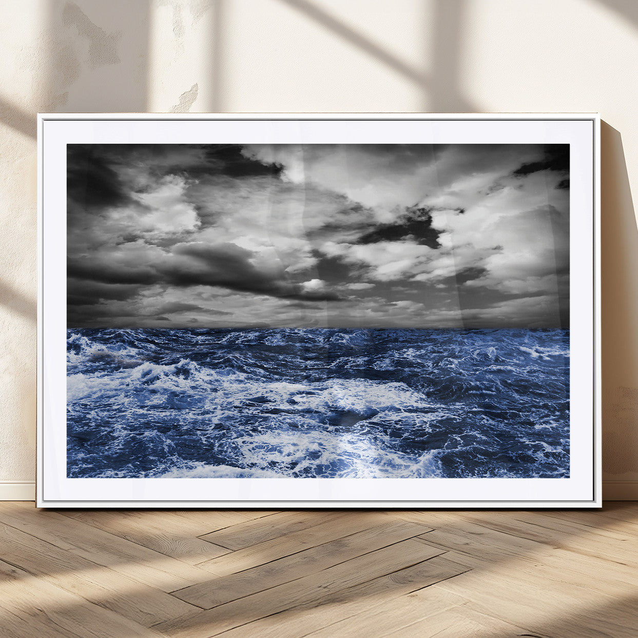 Moody canvas wall art of a stormy ocean under a dramatic black-and-white sky, perfect for bold or coastal-style interiors.