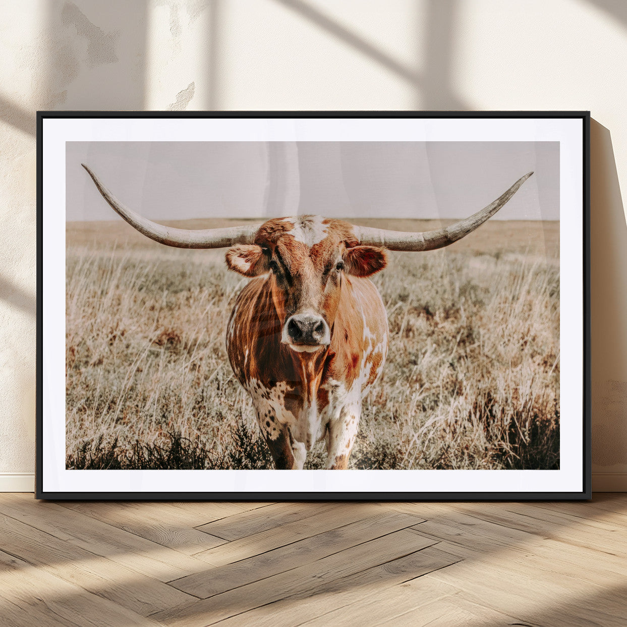 Framed longhorn cow canvas wall art with rustic prairie background, western animal print perfect for farmhouse or ranch style decor