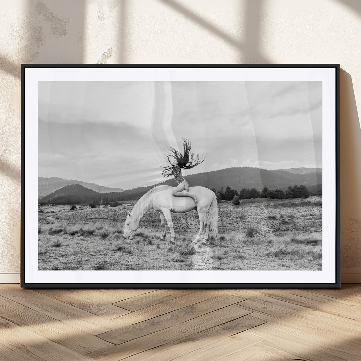 Black and white photo of a woman on a white horse in moody tones, ideal for Western Boho or modern rustic-style home decor.