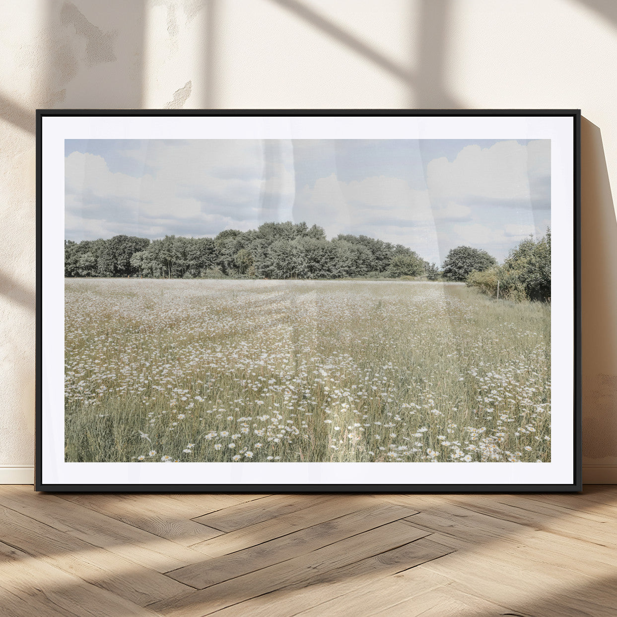 Soft-toned image of a wild daisy field under a cloudy sky, ideal for neutral or Scandinavian-inspired home decor.