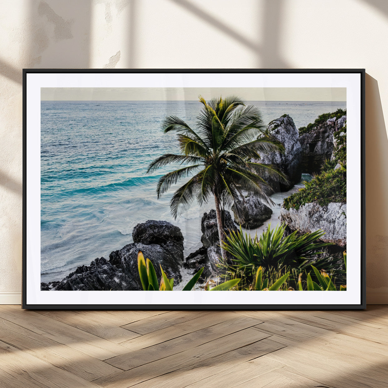 Framed canvas of a vibrant tropical coastline with palm trees, rocky cliffs, and turquoise waters, ideal for tropical coastal home decor.