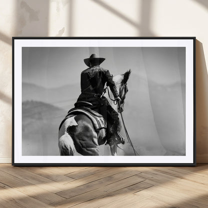 Black and white canvas of a cowboy on horseback with moody tones, perfect for rustic western or country-inspired home decor.