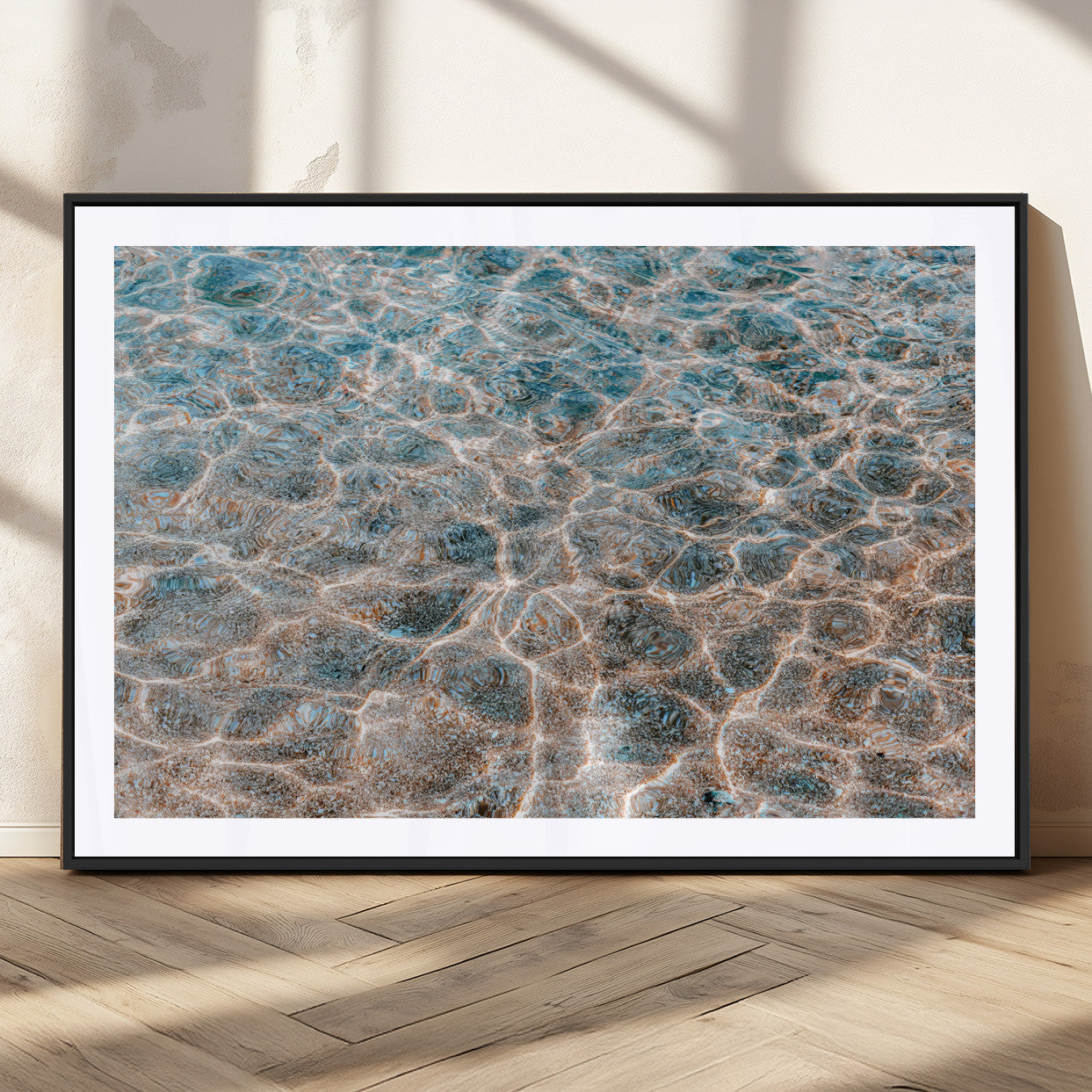 Close-up of sunlit ocean ripples with aqua blue and golden tones, ideal for modern coastal or minimalist home decor.