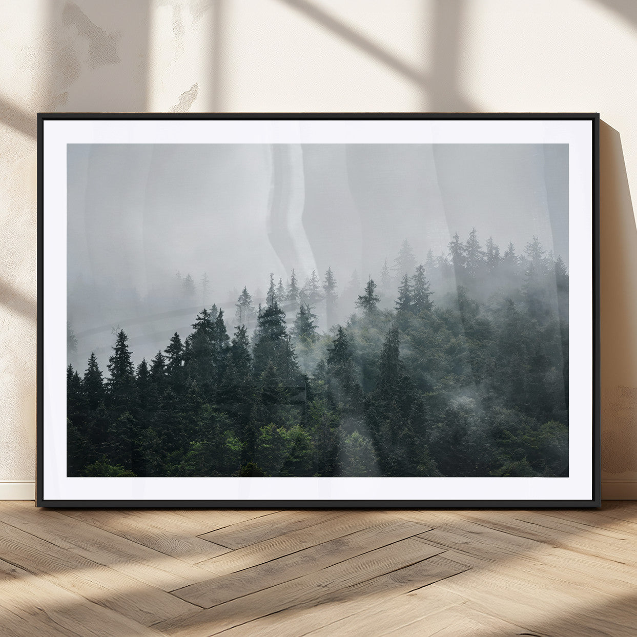 A misty evergreen forest shrouded in soft fog, creating a tranquil and moody landscape with lush green trees fading into the distance.
