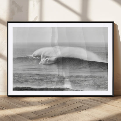 A dramatic black and white ocean wave crashing with immense force, capturing the raw power and movement of the sea in a bold seascape.
