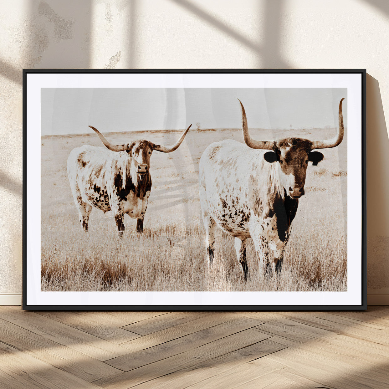 Two Texas longhorn cows standing in a sepia-toned pasture, evoking rustic charm perfect for farmhouse or western country interiors. (