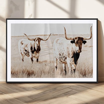 Two Texas longhorn cows standing in a sepia-toned pasture, evoking rustic charm perfect for farmhouse or western country interiors. (