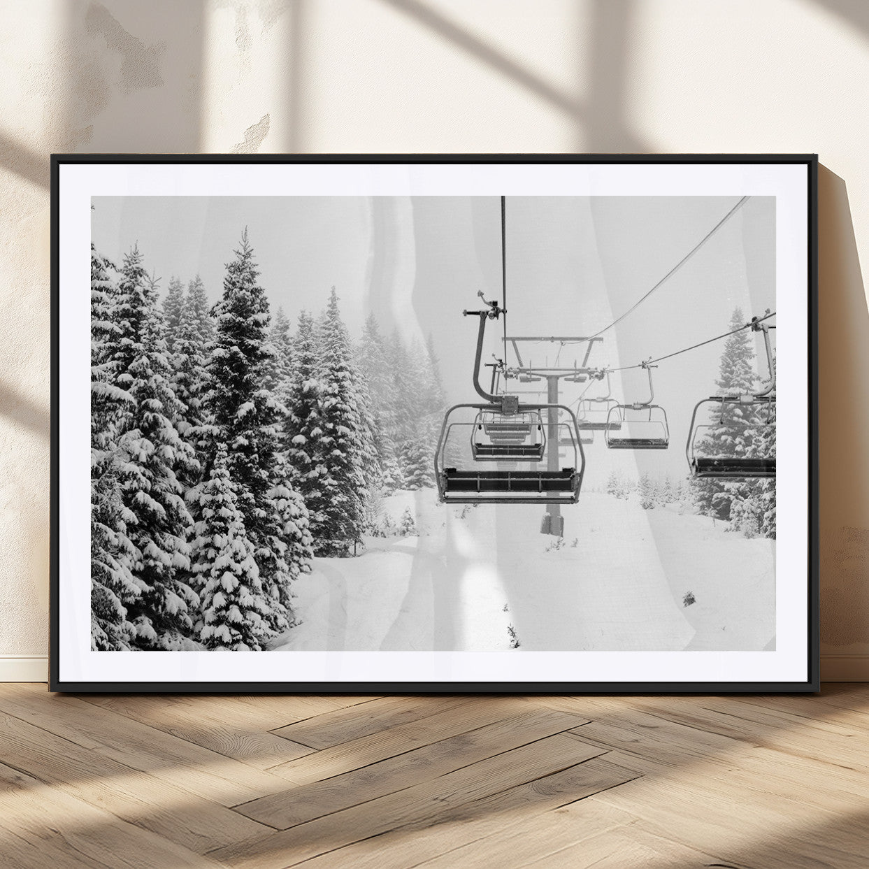 Black and white canvas of empty ski lifts over a snowy pine forest, perfect for minimal winter or ski lodge-inspired decor.