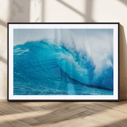 Vibrant canvas of a powerful curling ocean wave in tropical blue tones, perfect for coastal or surf-inspired decor settings.