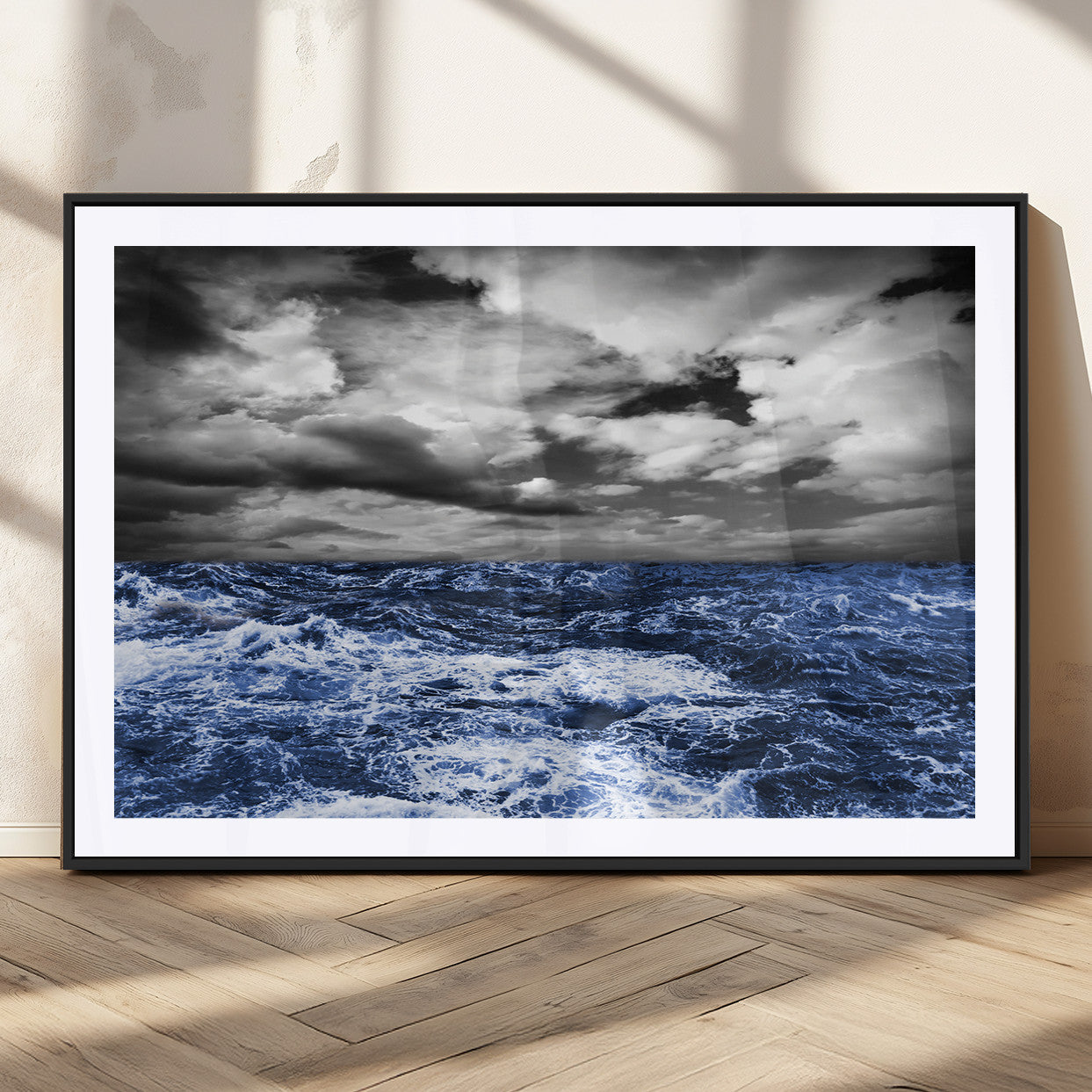 Moody canvas wall art of a stormy ocean under a dramatic black-and-white sky, perfect for bold or coastal-style interiors.