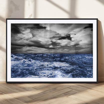 Moody canvas wall art of a stormy ocean under a dramatic black-and-white sky, perfect for bold or coastal-style interiors.