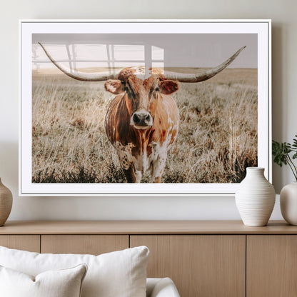 Framed longhorn cow canvas wall art with rustic prairie background, western animal print perfect for farmhouse or ranch style decor