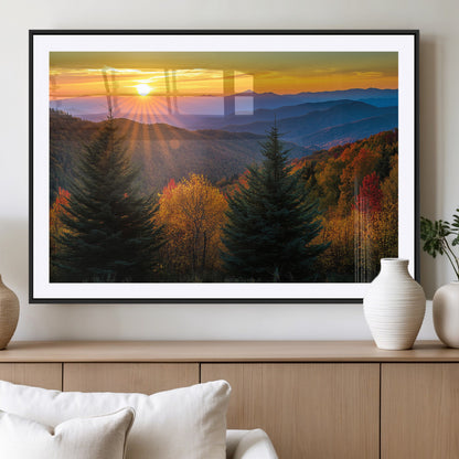 Vibrant sunset over autumn mountains with colorful trees and warm light, ideal for nature lovers or cabin-style wall decor.
