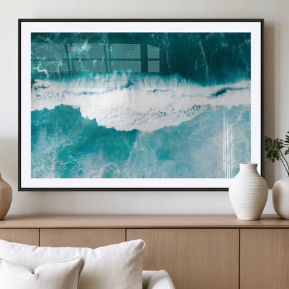 Aerial view of turquoise ocean waves crashing with white foam, perfect for tropical coastal or modern beach-style home decor.