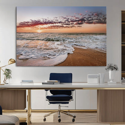 Canvas of a sunset over a foamy ocean shore with warm light and gentle waves, ideal for coastal or beach-themed home decor.