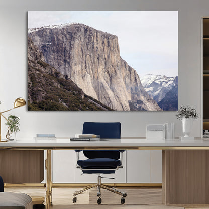 Framed canvas of El Capitan’s vertical granite face in Yosemite with snowy peaks, ideal for Sierra minimalism or mountain-inspired decor.