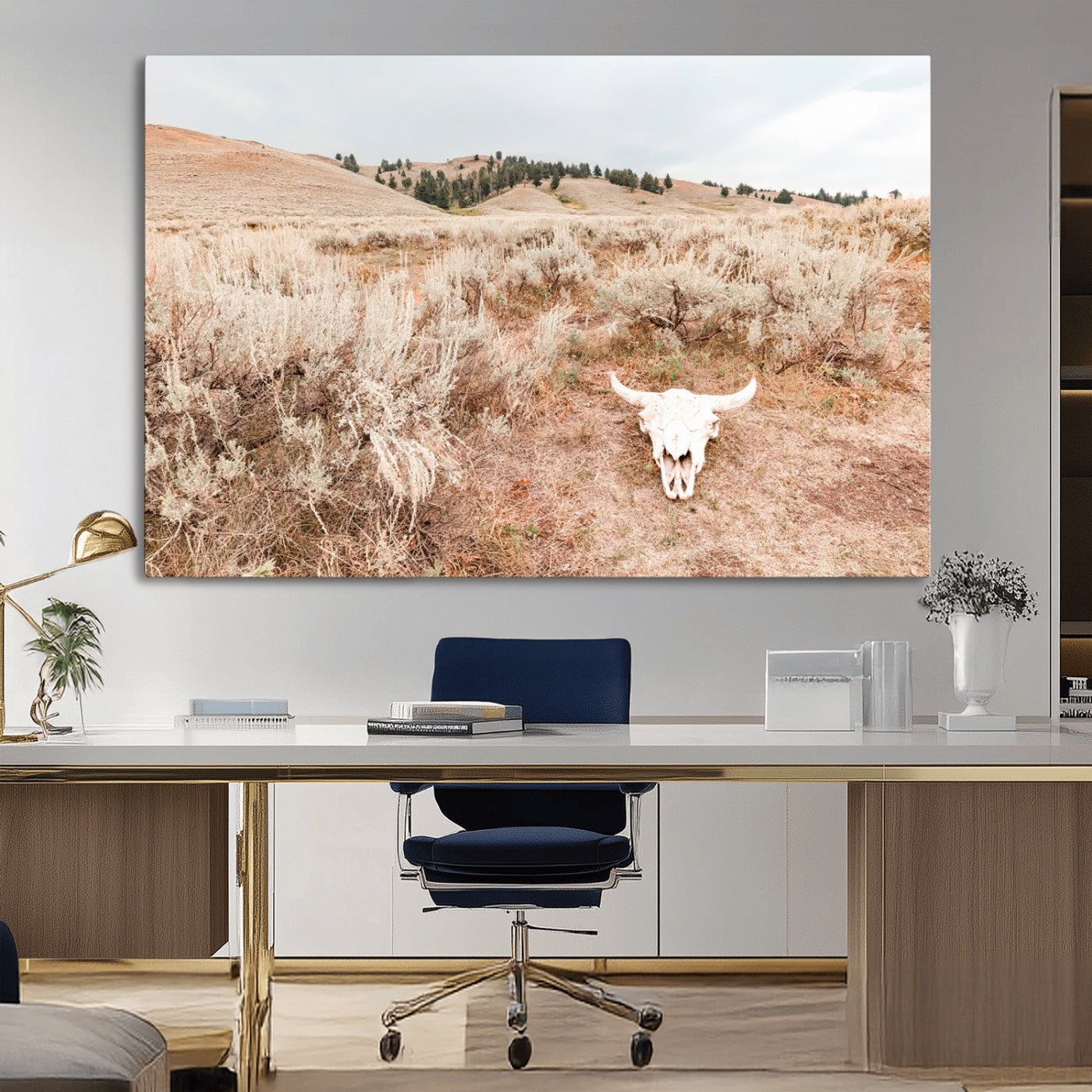 Rustic bull skull on dry sagebrush field under soft light, ideal for western minimal or desert prairie-style wall decoration.
